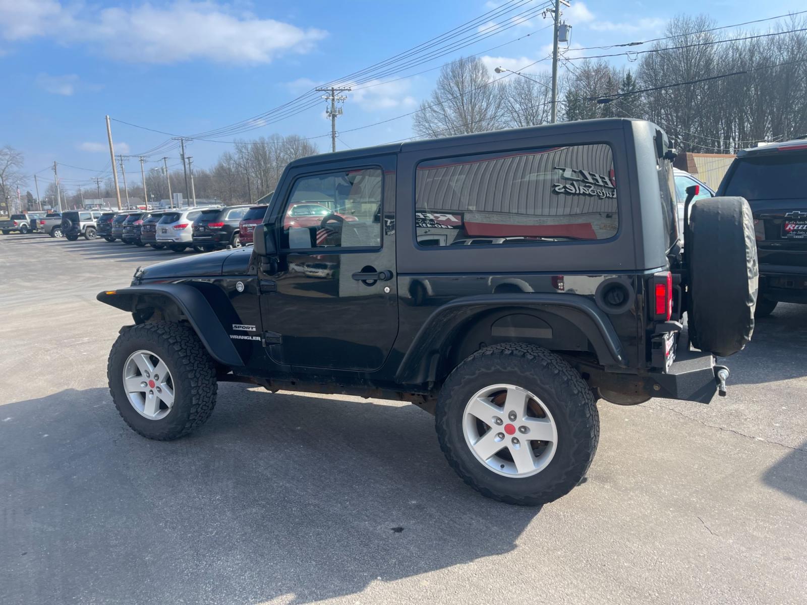 2013 Black /Black Jeep Wrangler Sport 4WD (1C4AJWAG0DL) with an 3.6L V6 DOHC 24V FFV engine, 6 Speed Manual transmission, located at 547 E. Main St., Orwell, OH, 44076, (440) 437-5893, 41.535435, -80.847855 - This 2013 Jeep Wrangler Sport 4WD, equipped with a robust 3.6L Pentastar V6 engine and a 6-speed manual transmission, represents a premium blend of performance and rugged capability. Its Trail Rated designation underscores a commitment to off-road excellence, featuring modifications such as LED head - Photo #11